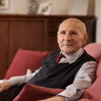 Elderly Man Sitting in Armchair