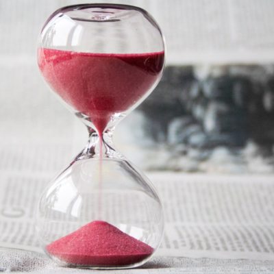 Hourglass with red sand