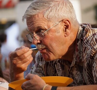 an elderly person eating