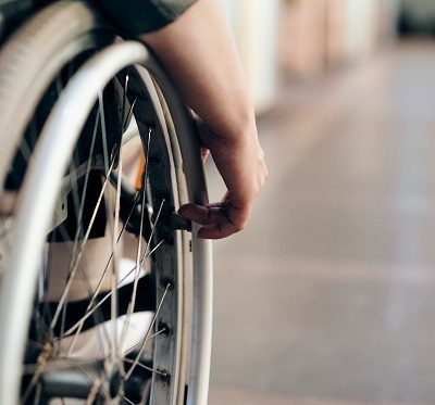 person in wheelchair, a visible physical disability